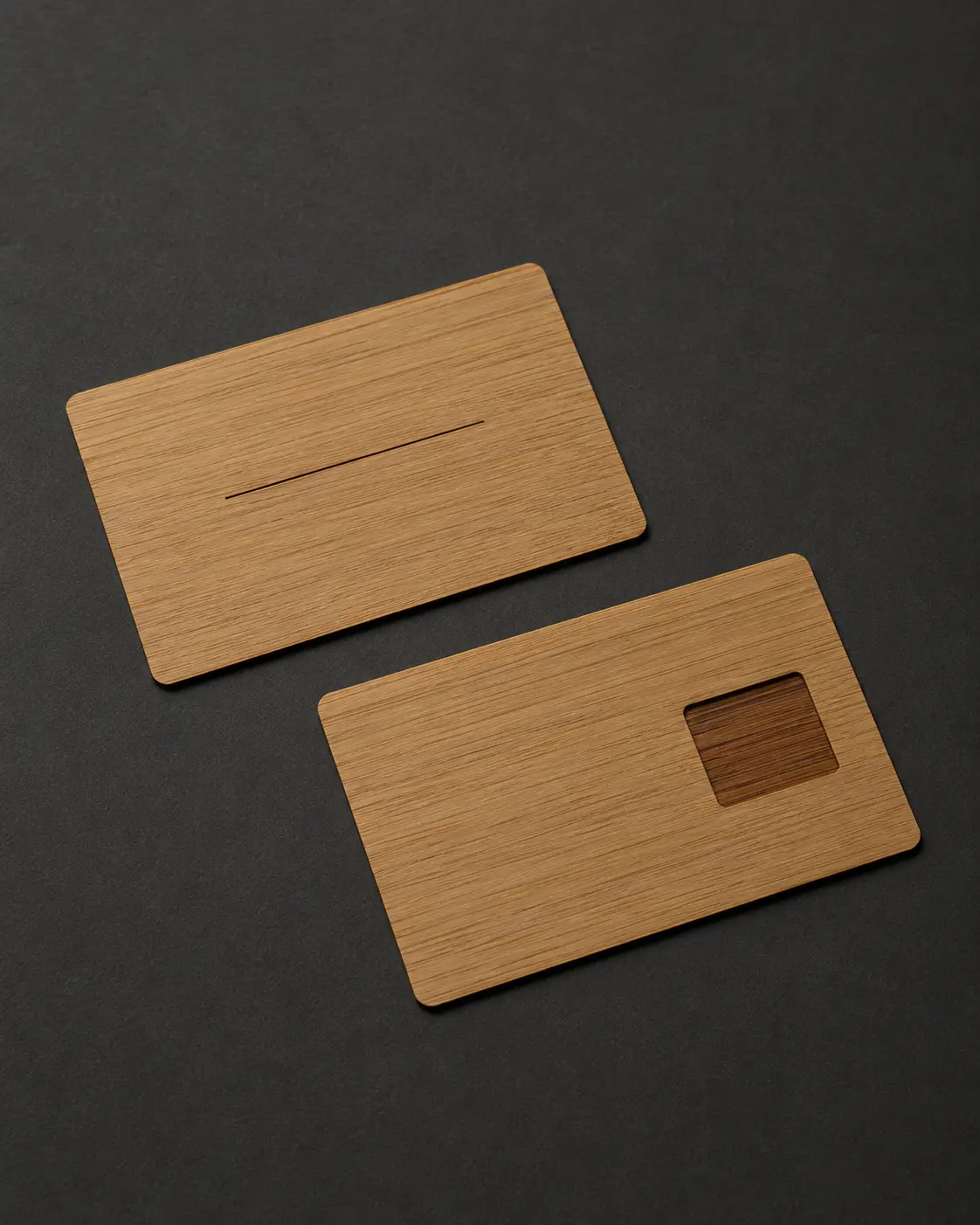 Front and reverse of thin bamboo identity cards with a flush NFC accommodation