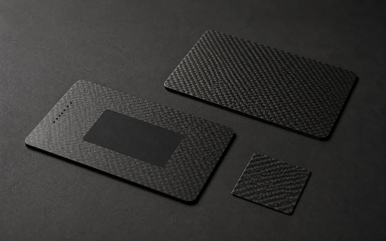 Thin carbon-fibre identity cards with an integrated non-conductive NFC area
