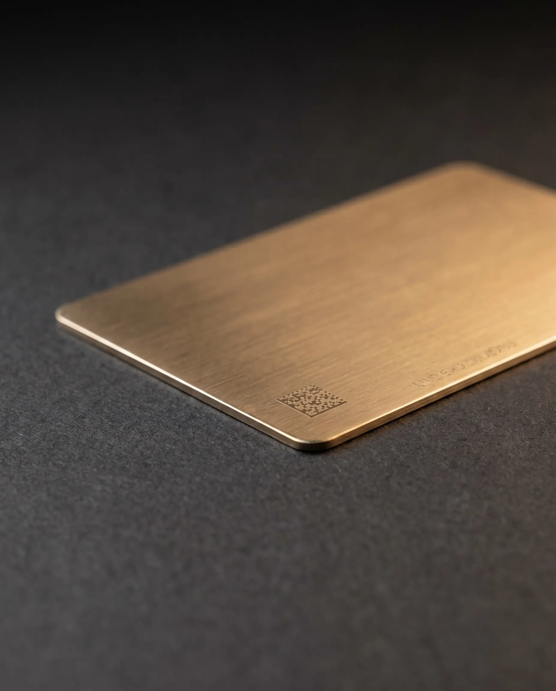 Macro detail of a thin brushed gold card with variable marking