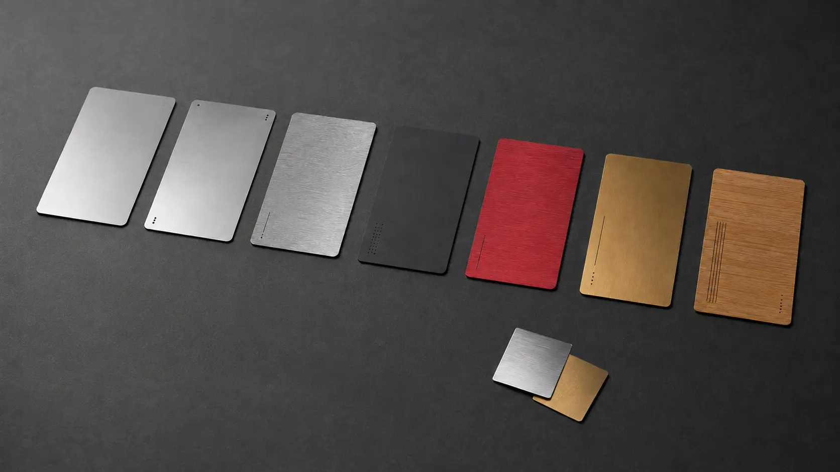 A sequence of thin card prototypes progressing through materials and finishes