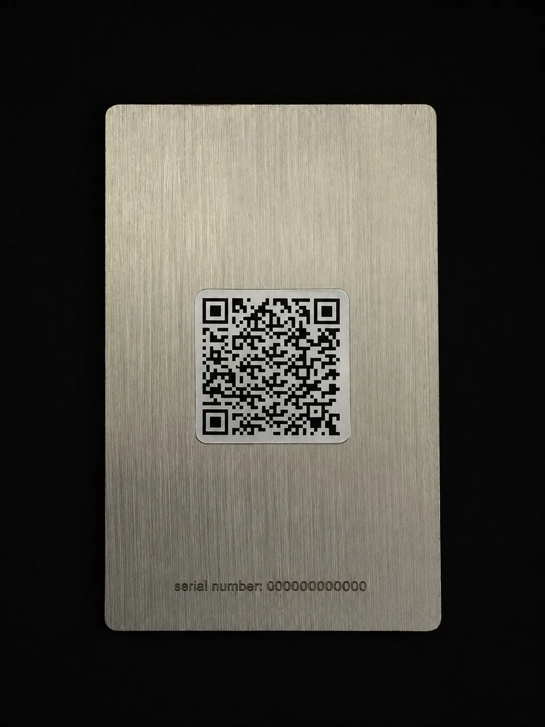 Reverse of a champagne-tone Bottega Veneta connected metal card with QR code and neutral serial reference