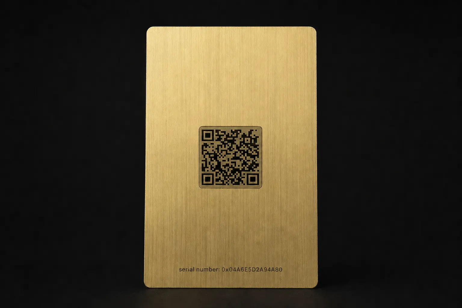 Reverse of a gold-tone Bottega Veneta connected metal card with QR code and serial reference